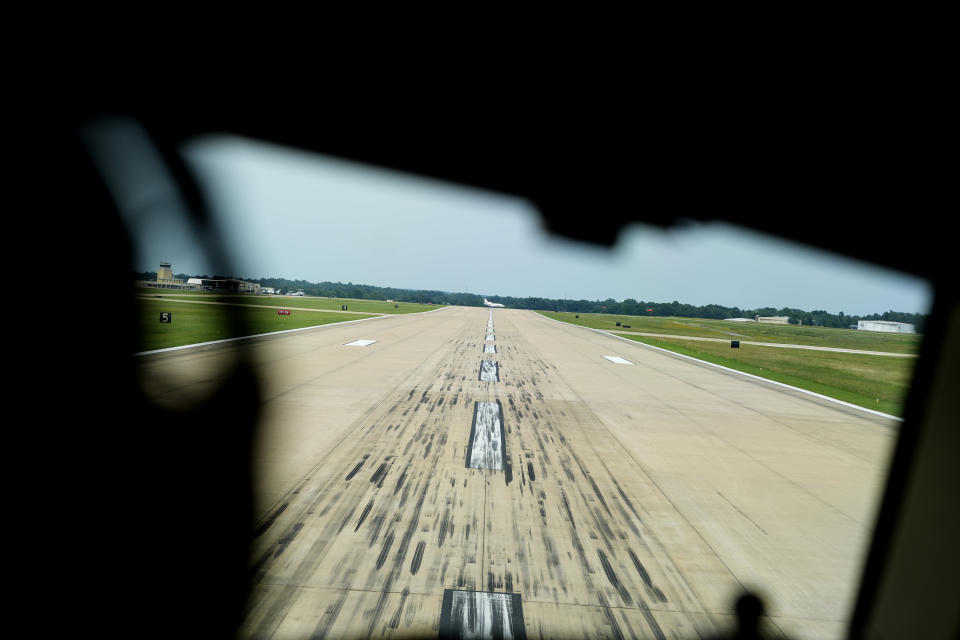 A jet crosses a runway creating a hazard, seen from a Boeing 757 test aircraft cockpit demonstrating runway hazard warning systems, at the airport in Tyler, Texas, Tuesday, June 4, 2024. (AP Photo/LM Otero)