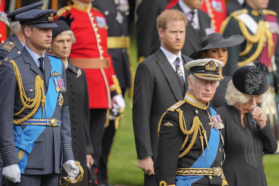 King Charles III, from right, Camilla, the Queen Consort, Meghan, Duchess of Sussex, Prince Harry and Prince William watch as the coffin of Queen Elizabeth II is placed into the hearse following the state funeral service in Westminster Abbey in central London Monday Sept. 19, 2022. The Queen, who died aged 96 on Sept. 8, will be buried at Windsor alongside her late husband, Prince Philip, who died last year. (AP Photo/Martin Meissner, Pool)