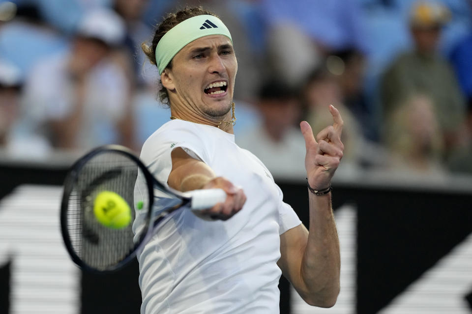Alexander Zverev of Germany plays a forehand return to Cameron Norrie of Britain during their fourth round match at the Australian Open tennis championships at Melbourne Park, Melbourne, Australia, Monday, Jan. 22, 2024. (AP Photo/Alessandra Tarantino)