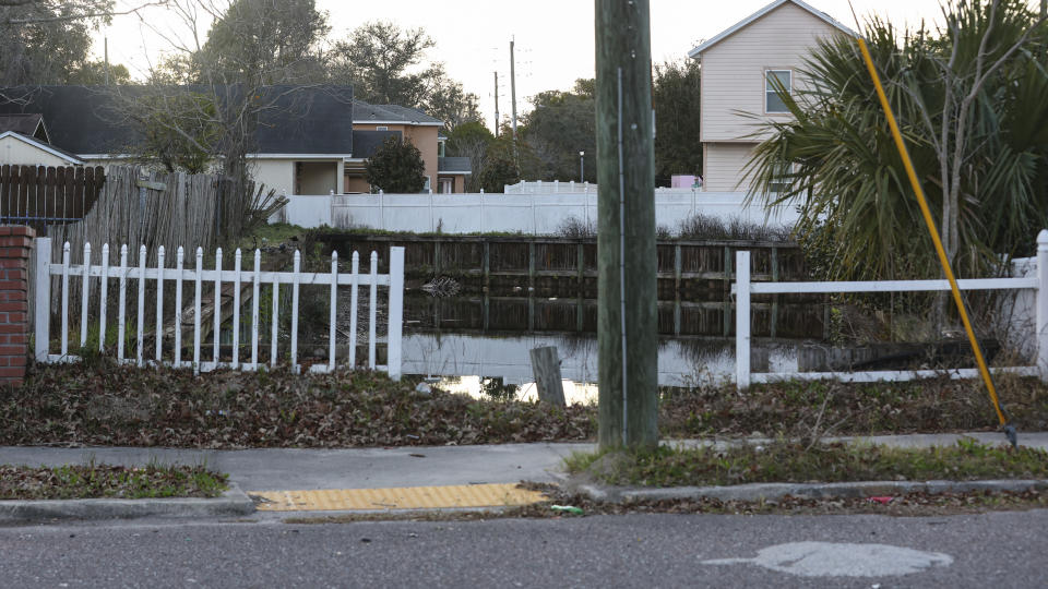 A damaged barricade around a retention pond in an area impacted by a local gerrymandering case is seen in Jacksonville, Fla., Jan. 30, 2023. A protracted legal fight over how city council districts were drawn in Jacksonville, Florida, reflects an aspect of redistricting that often remains in the shadows. Political map-drawing for congressional and state legislative seats captures wide attention after new census numbers are released every 10 years. No less fierce are the battles over the way voting lines are drawn in local governments, for city councils, county commissions and even school boards. (AP Photo/Gary McCullough)