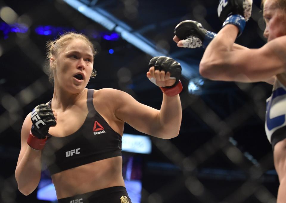 Ronda Rousey of the US (L) lines up compatriot Holly Holm during the UFC title fight in Melbourne on November 15, 2015.   RESTRICTED TO EDITORIAL USE NO ADVERTISING USE NO PROMOTIONAL USE NO MERCHANDISING USE.  AFP PHOTO/Paul CROCK        (Photo credit should read PAUL CROCK/AFP/Getty Images)