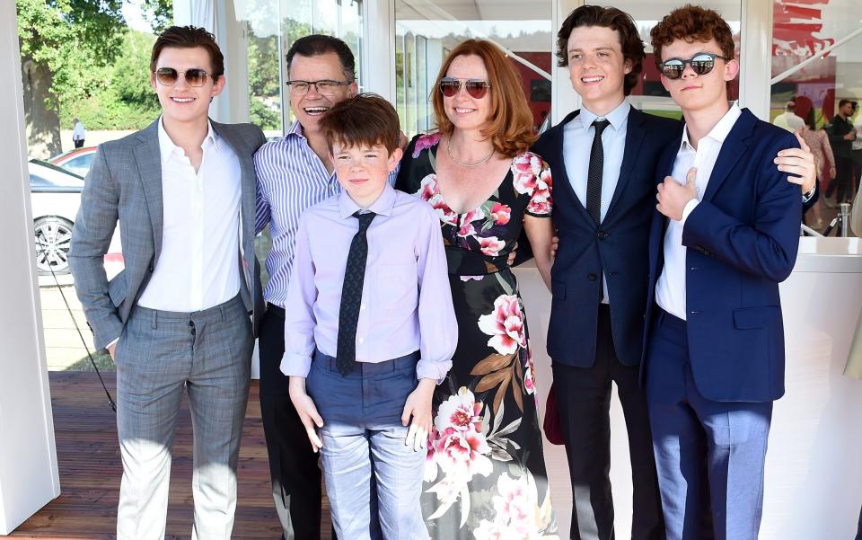 Tom Holland poses with his family Dominic Holland, Paddy Holland, Nicola Holland, Sam Holland and Harry Holland - Getty