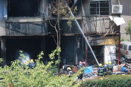 Firefighters work at the site of an explosion at a restaurant in Hangzhou, Zhejiang province, China July 21, 2017. REUTERS/Stringer