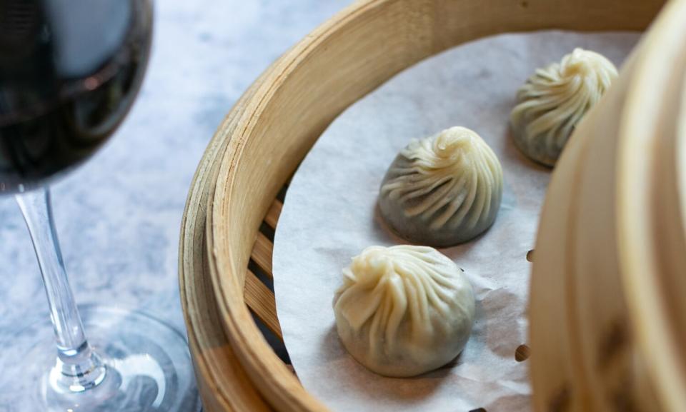 An overhead photo of chocolate mochi dumplings in a steam basket.