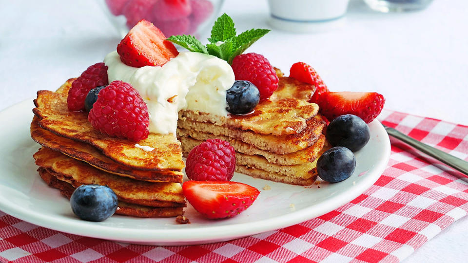 Keto crepes topped with berries and whipped cream