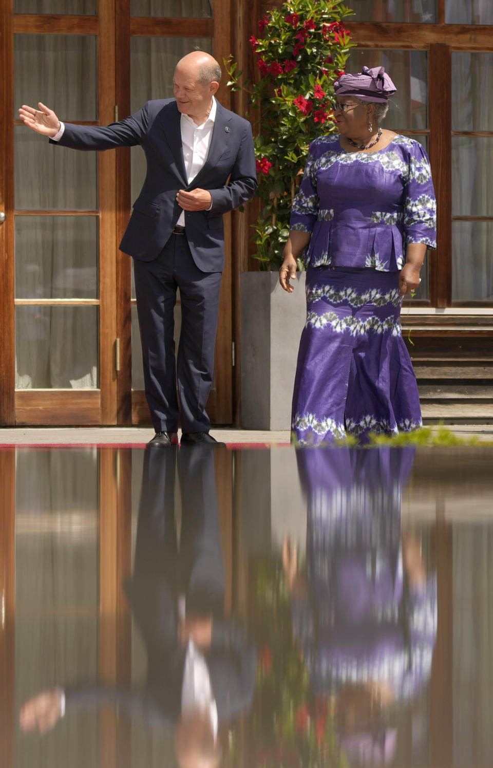 German Chancellor Olaf Scholz, left, greets World Trade Organization Director-General Ngozi Okonjo-Iweala during the official welcome ceremony of G7 leaders and Outreach guests at Castle Elmau in Kruen, near Garmisch-Partenkirchen, Germany, on Monday, June 27, 2022. The Group of Seven leading economic powers are meeting in Germany for their annual gathering Sunday through Tuesday. (AP Photo/Markus Schreiber)