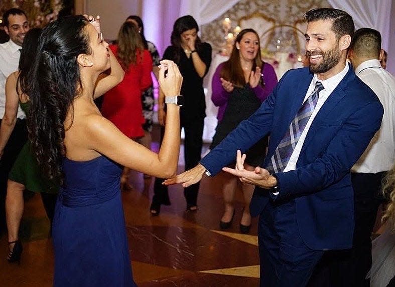 Joanna and her husband dancing at a wedding