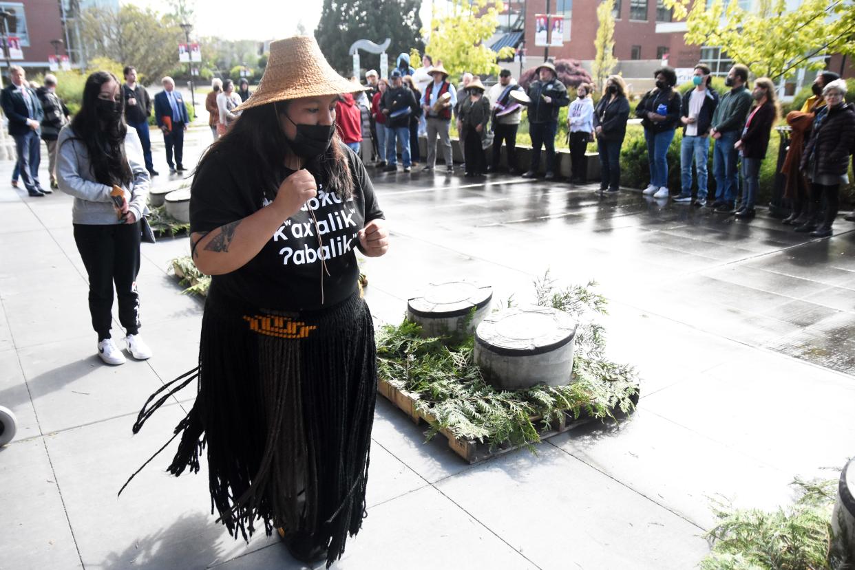 Denita Holmes, Suquamish Tribe treasurer, dances at an event celebrating markers commemorating the Lushootseed language at Olympic College in Bremerton on Thursday.