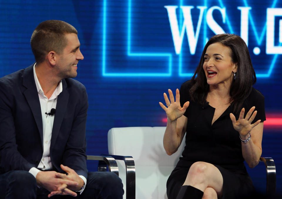 Chris Cox, Chief Product Officer and Sheryl Sandberg, Chief Operating Officer of Facebook speak at the WSJD Live conference in Laguna Beach, California October 25, 2016.     REUTERS/Mike Blake 