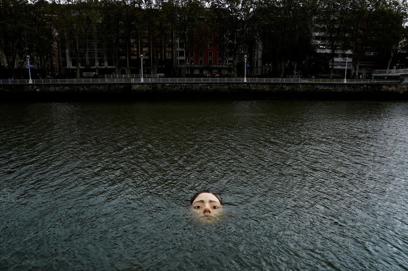 A fibreglass sculpture entitled 'Bihar' is submerged in the Nervion river in Bilbao