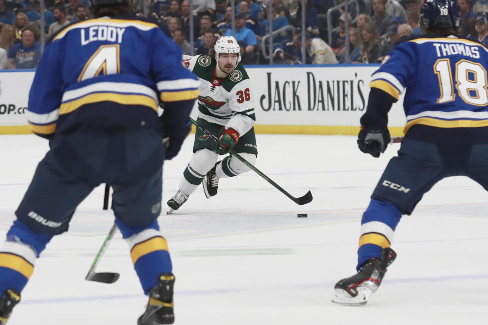 Minnesota Wild right wing Mats Zuccarello (36) works the puck against St. Louis Blues during the first period in Game 6 of an NHL hockey Stanley Cup first-round playoff series Thursday, May 12, 2022, in St. Louis. (AP Photo/Michael Thomas)