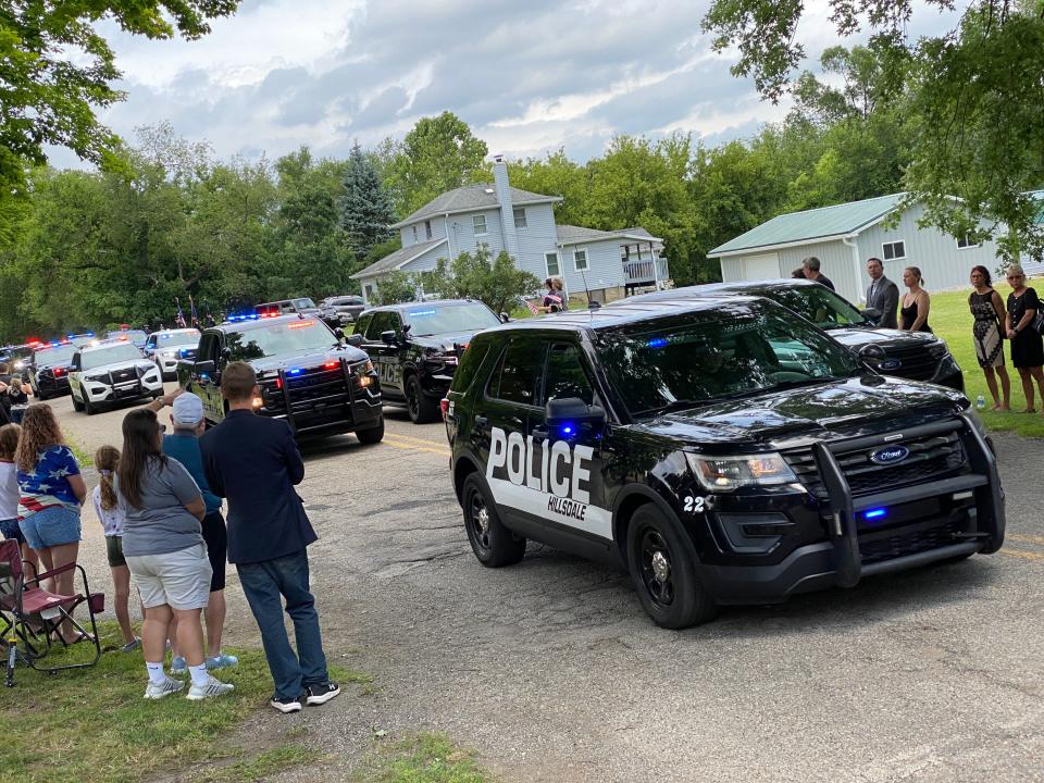 The law enforcement procession arrives Wednesday at Lakeview Cemetery in Hillsdale for the graveside services for Hillsdale County Sheriff's Deputy William Butler Jr.