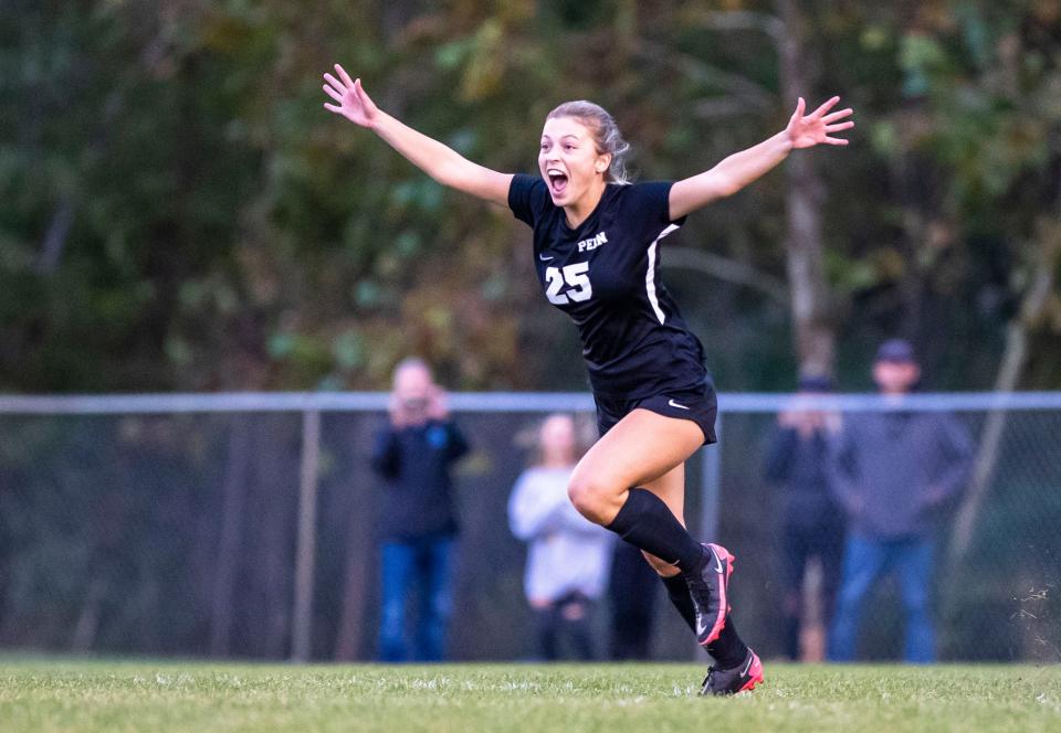 Penn’s Tara Dauby celebrates scoring the game-winning penalty kick during the Penn vs. Saint Joseph High School sectional soccer game Thursday, Oct. 6, 2022 at the Northfield Athletic Complex in South Bend.