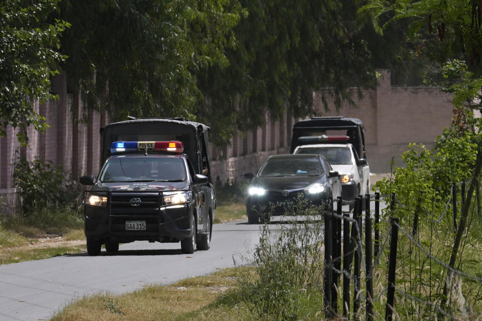 A police squad escort a car carrying a judge of special court leaving after a case hearing of Pakistan's former Prime Minister Imran Khan at the District Jail, in Attock, Pakistan, Wednesday, Aug. 30, 2023. A court asked the official in charge of the Attock prison to keep former Prime Minister Khan there until at least Wednesday, when Khan is expected to face a hearing on charges of "exposing an official secret document" in an incident last year when he waved a confidential diplomatic letter at a rally. The Islamabad High Court on Tuesday suspended the corruption conviction and three-year prison term of him, his lawyers and court officials said. (AP Photo/Anjum Naveed)