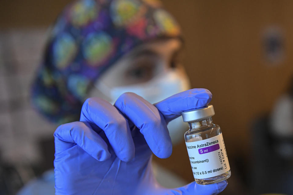 A health worker holds a dose of the AstraZeneca COVID-19 vaccine, during a mass vaccination campaign at San Pedro Hospital, in Logrono, northern Spain, Wednesday, March 24, 2021. Spain resumed the use of the AstraZeneca vaccine on Wednesday. (AP Photo/Alvaro Barrientos)