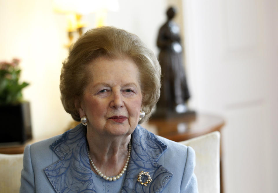 Britain's former Prime Minister Margaret Thatcher looks towards the camera as she meets Prime Minister David Cameron inside 10 Downing Street in London June 8, 2010.  REUTERS/Suzanne Plunkett (BRITAIN - Tags: POLITICS PROFILE)