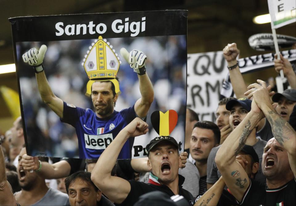 <p>Juventus supporters with a banner of Juventus goalkeeper Gianluigi Buffon before the Champions League final soccer match between Juventus and Real Madrid at the Millennium stadium in Cardiff </p>