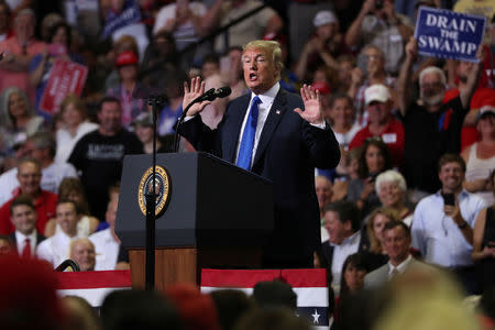 FILE PHOTO: U.S. President Donald Trump addresses supporters during a Make America Great Again rally in Southaven, Mississippi, U.S. October 2, 2018. REUTERS/Jonathan Ernst