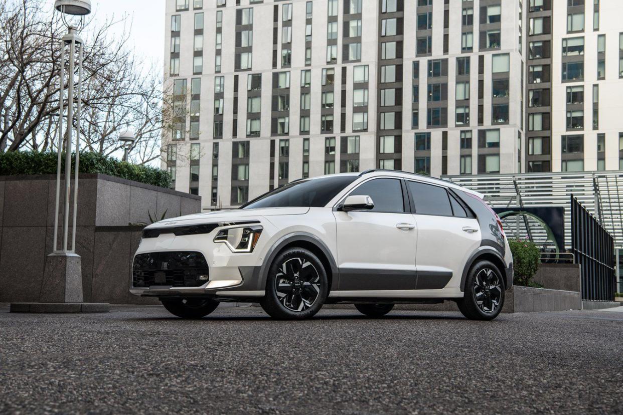 White 2024 Kia Niro EV parked in front of building