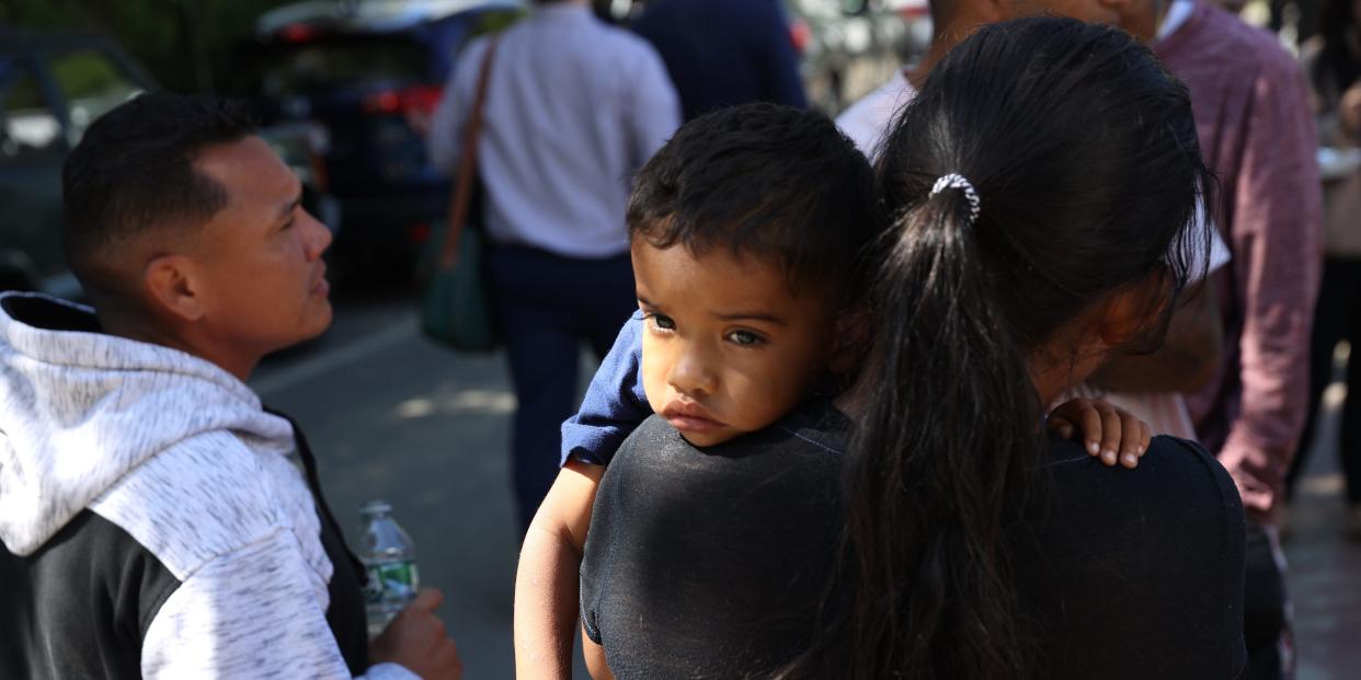 A mother holds her son.