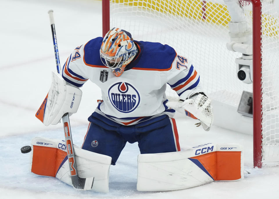 Edmonton Oilers goaltender Stuart Skinner makes a save against the Florida Panthers during second-period Game 2 action in the NHL hockey Stanley Cup Finals in Sunrise, Fla., Monday, June 10, 2024. (Nathan Denette/The Canadian Press via AP)