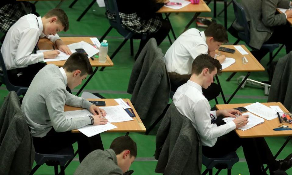 Students sitting an exam – the British system is skewed towards academic success.