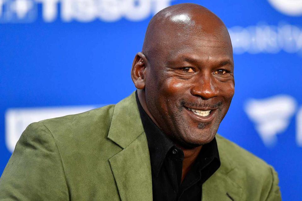 Aurelien Meunier/Getty Michael Jordan smiling for a photograph