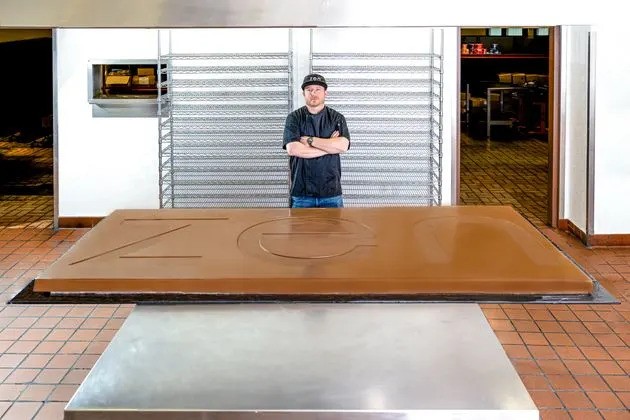 Zen Cannabis employee Shane Ferrante poured the chocolate for a 420-pound chocolate bar that contains 4,200,000 mg of THC.