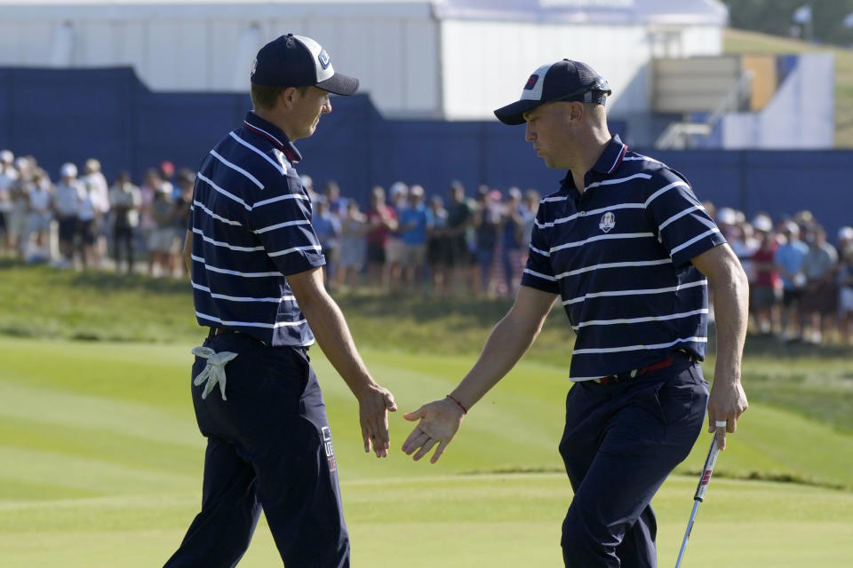 United States' Jordan Spieth, left celebrates with United States' Justin Thomas on the 13th green during their afternoon Fourballs match at the Ryder Cup golf tournament at the Marco Simone Golf Club in Guidonia Montecelio, Italy, Friday, Sept. 29, 2023. (AP Photo/Gregorio Borgia )