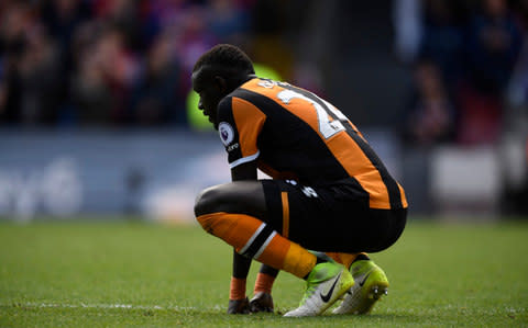 Oumar Niasse looks on after Crystal Palace score a third against Hull during his loan spell - Credit: REUTERS