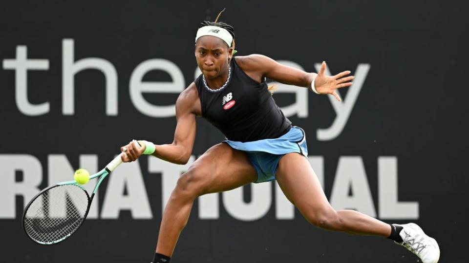 coco gauff lunging with her racket to hit a tennis ball