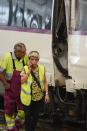 <p>Workers stand by a damaged train on the platform of a train station in Barcelona, Spain, Friday, July 28, 2017. (Photo: Adrian Quiroga/AP) </p>