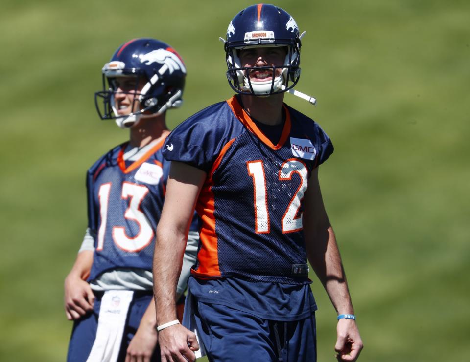 Paxton Lynch (12) is trailing Trevor Siemian in the battle for the starting Broncos QB job. (AP) 