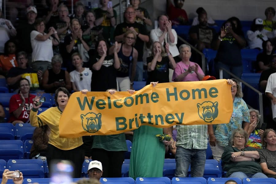 Fans hold up a sign after Brittney Griner was introduced in the Phoenix Mercury starting lineup for a WNBA basketball game against the Dallas Wings, June 7, 2023, in Arlington, Texas. (AP Photo/Tony Gutierrez, File)