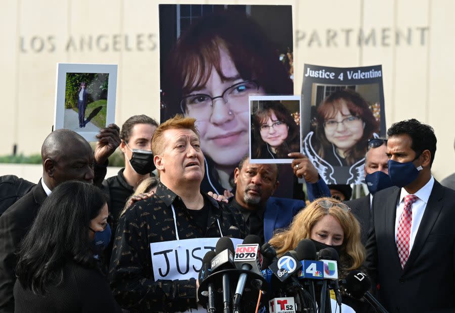 Soledad Peralta and Juan Pablo Orellana Larenas, parents of 14-year old Valentina Orellana-Peralta, who was killed by a stray police bullet while shopping at a clothing store, attend a press conference outside LAPD headquarters in Los Angeles on Dec. 28, 2021. (Robyn Beck AFP via Getty Images)