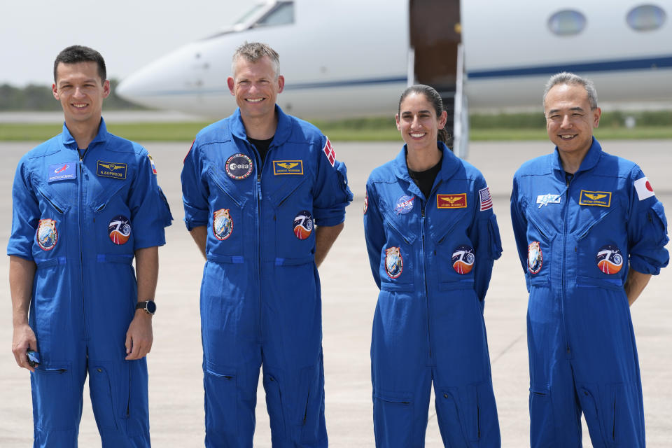 Astronauts, from left, Russian cosmonaut Konstantin Borisov, Danish astronaut Andreas Mogensen, NASA astronaut Jasmin Moghbeli and Japanese astronaut Satoshi Furukawa pose for a photo at a news conference at the Kennedy Space Center as they prepare for their mission to the International Space Station in Cape Canaveral, Fla., Sunday, Aug. 20, 2023. The launch to the space station is scheduled for early Friday, Aug 25. (AP Photo/John Raoux)