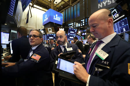 Traders work on the floor of the New York Stock Exchange (NYSE) in New York, U.S., January 22, 2019. REUTERS/Brendan McDermid
