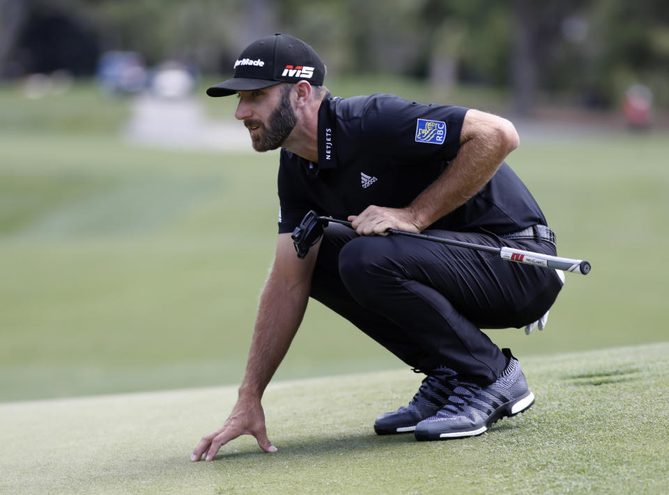 Dustin Johnson lines up a putt on the sixth green during the final round of the RBC Heritage golf tournament at Harbour Town Golf Links on Hilton Head Island, S.C., Sunday, April 21, 2019. Johnson was the third round leader but shot a six over par 77 during the final round. (AP Photo/Mic Smith)