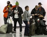 Holiday travelers wait for trains to be called at Penn Station in New York, November 26, 2014. REUTERS/Brendan McDermid