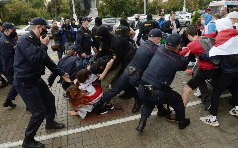 Police and protesters clash in Belarus's capital, Minsk, yesterday - Shutterstock