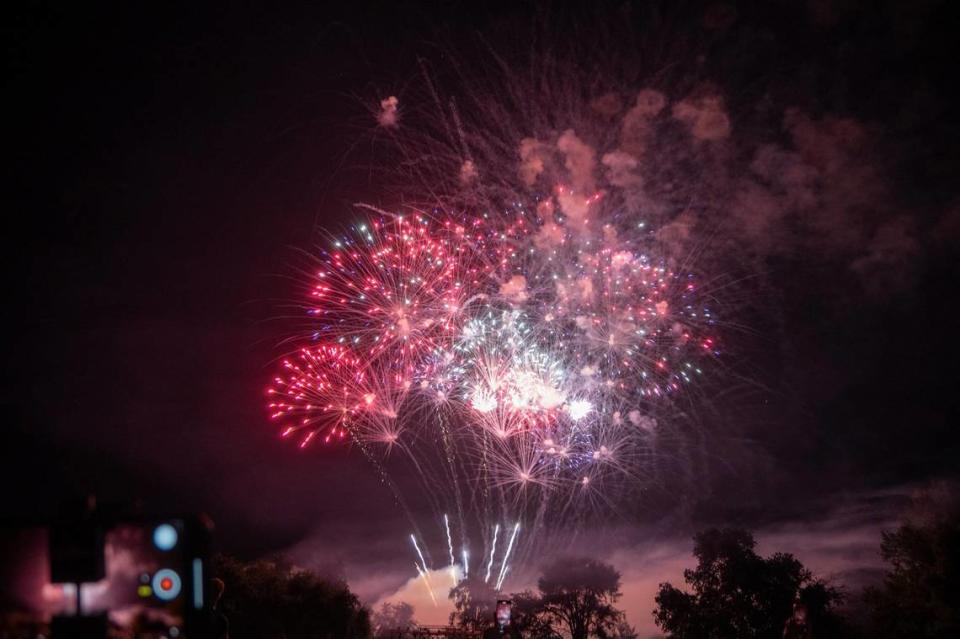 Fireworks explode illuminate the skyline over Hagan Park in Rancho Cordova on Wednesday during the city’s Fourth of July celebration.