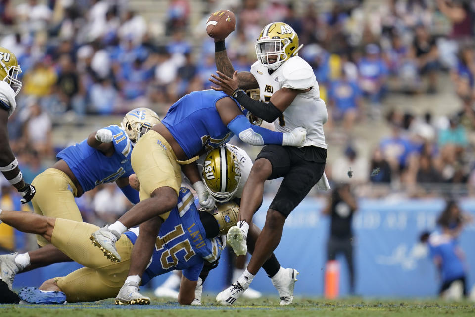 UCLA defensive lineman Grayson Murphy (12) sacks Alabama State quarterback Myles Crawley (7) during the first half of an NCAA college football game in Pasadena, Calif., Saturday, Sept. 10, 2022. (AP Photo/Ashley Landis)