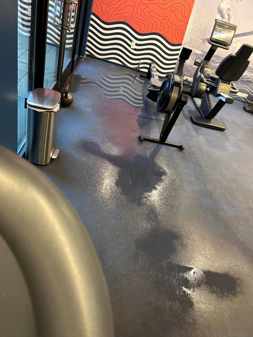 Water inside a fitness room.