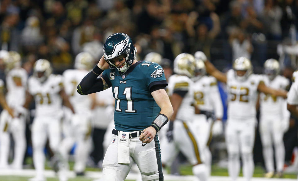 Philadelphia Eagles quarterback Carson Wentz (11) walks off the field after turning the ball over on downs in the second half of an NFL football game against the New Orleans Saints in New Orleans, Sunday, Nov. 18, 2018. (AP Photo/Butch Dill)