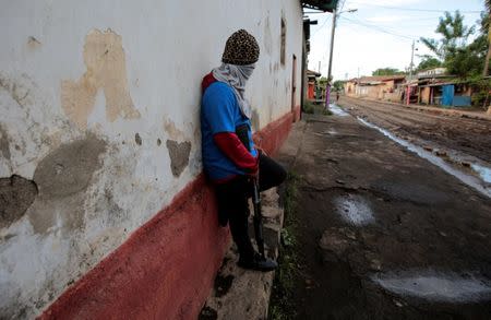 A pro-government supporter stands near a barricade after clashes with demonstrators in the indigenous community of Monimbo in Masaya, Nicaragua July 17, 2018. REUTERS/Oswaldo Rivas