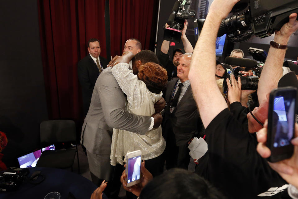 Greg Robinson, from Auburn, reacts after being selected second overall in the first round of the NFL football draft by the St. Louis Rams, Thursday, May 8, 2014, at Radio City Music Hall in New York. (AP Photo/Jason DeCrow)