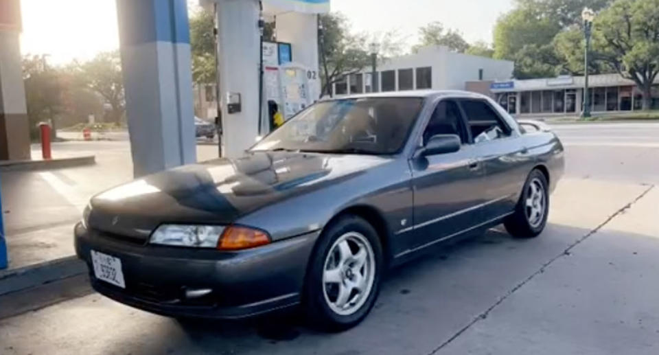 1994 Nissan Skyline parked at petrol station