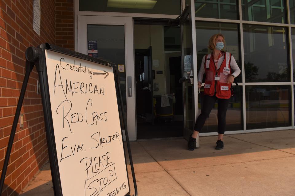 American Red Cross volunteer Faith Reihing stands outside the pop-up shelter for evacuees of the Cameron Peak Fire at Cache la Poudre Middle School in Laporte on Sept. 7, 2020.