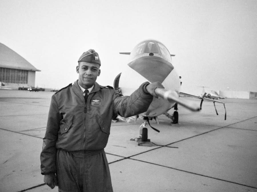 Captain Ed Dwight stands in front of the F-104 jet fighter, which he flies today seem mighty tame when he starts training in specially-equipped, high-performance jets that will soar to the edge of space. (Photo by Bettmann Archive/Getty Images)