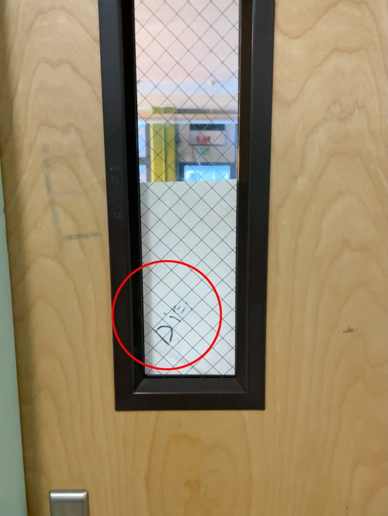 The word “die” written on the door of a Jewish teacher’s classroom at Origins High School.
